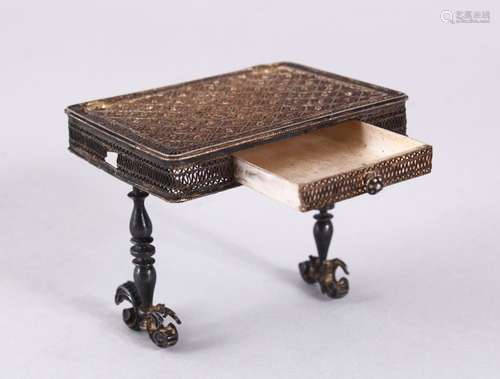 A FINE ISLAMIC SILVER FILIGREE MINIATURE TABLE, with a drawer, 5.5 x 6.5