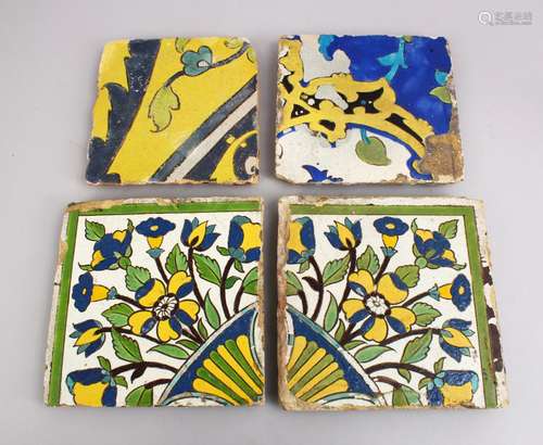 A COLLECTION OF FOUR 17TH / 18TH CENTURY PERSIAN SAFAVID POTTERY TILES, each with varying decor of