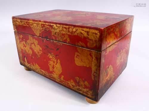 A PERSIAN RED & GOLD LACQUER DECORATED LIDDED BOX - With floral motif decoration upon four bun feet,