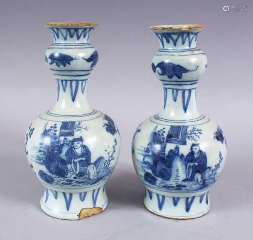 A PAIR OF CHINESE TRANSITIONAL BLUE & WHITE PORCELAIN VASES, each decorated with scenes of figures