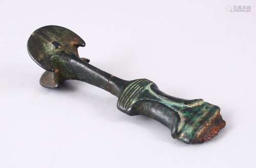 A FINE EARLY PERSIAN BRONZE DAGGER HANDLE, in the form of a twin axe, 14cm