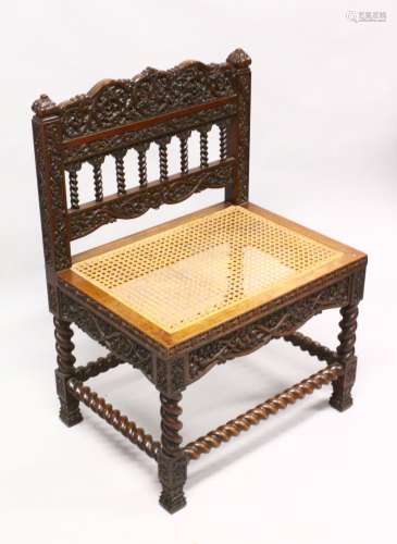 AN 18TH / 19TH CENTURY CEYLONESE CARVED ROSEWOOD CHAIR, with carved panels and wicker woven seat,