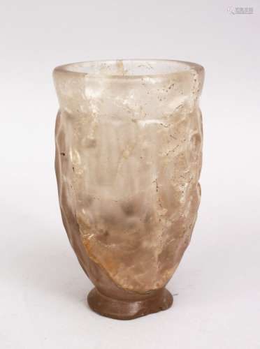 AN UNUSUAL CARVED ROCK CRYSTAL BEAKER, possibly early Persian, 11.5cm.