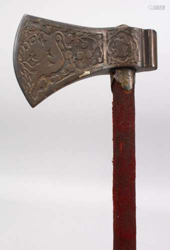 A FINE 18TH / 19TH CENTURY INDO PERSIAN ENGRAVED TABARZIN AXE, handle terminal has a concealed