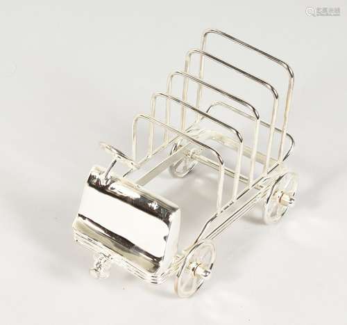 A NOVELTY PLATED CAR SHAPED TOAST RACK. 6.5ins long.