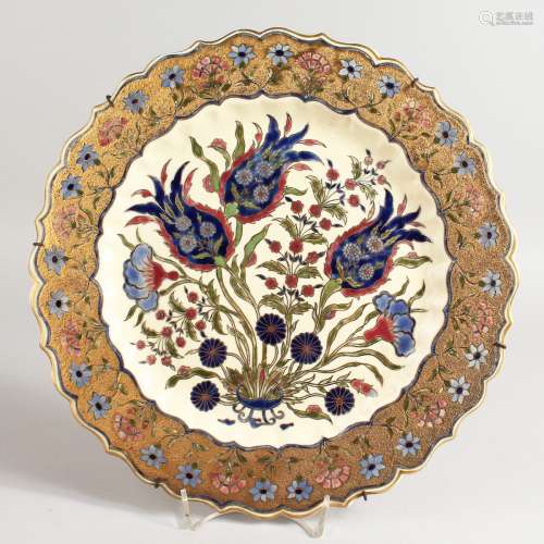A GOOD ZSOLNAY CIRCULAR SHAPED DISH, gilt decoration and rich blue flowers. 12ins diameter.
