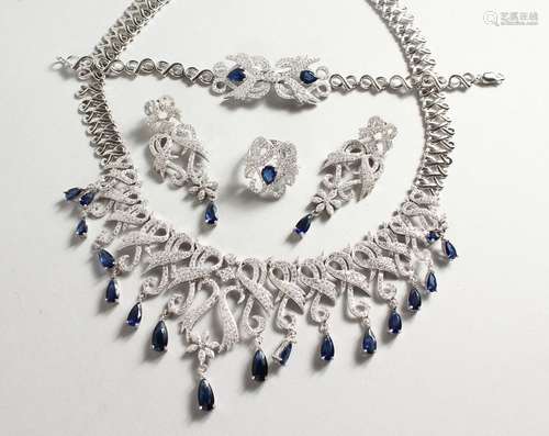 A SUPERB HEAVY SILVER FAUX SAPPHIRE FOUR PIECE SET. Necklace, bracelet, earrings and ring.