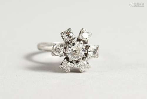 A SUPERB 18CT WHITE GOLD, DIAMOND FLOWER HEAD CLUSTER RING, a central diamond surrounded by six