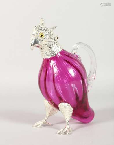 A NOVELTY SMALL CRANBERRY COLOUR GLASS CLARET JUG WITH PLATED MOUNTS, modelled as a parrot. 6.5ind