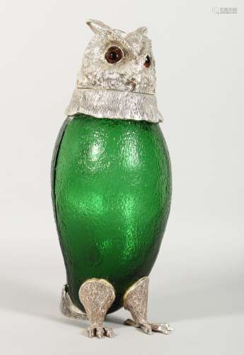 A LARGE GREEN GLASS OWL SHAPED CLARET JUG with plated mounts. 11.5ins high.