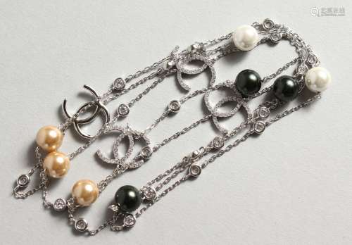 A SILVER CHANEL PATTERN PEARL NECKLACE.