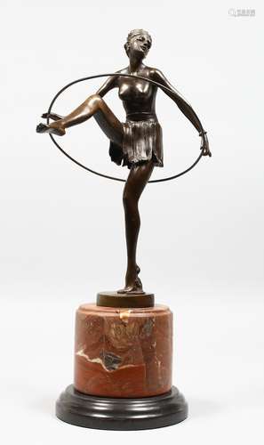 AN ART DECO STYLE BRONZE OF A DANCER on a circular marble base. 19ins high.