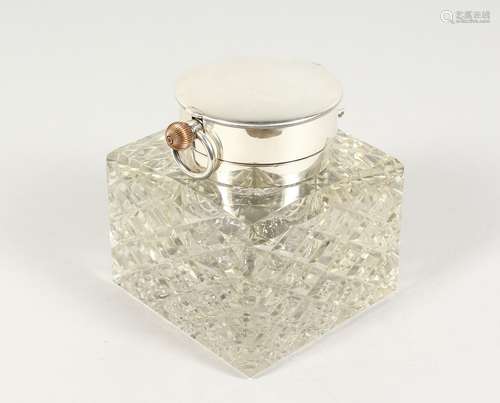 A VERY GOOD CUT GLASS AND SILVER SQUARE INKWELL, the top inset with a large watch, 3.75ins square.