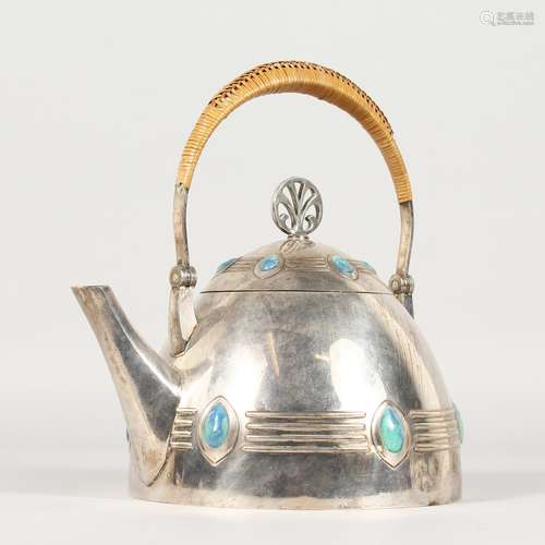 AN EARLY 20TH CENTURY WMF PLATED KETTLE, with straw-work handle and enamel decoration.