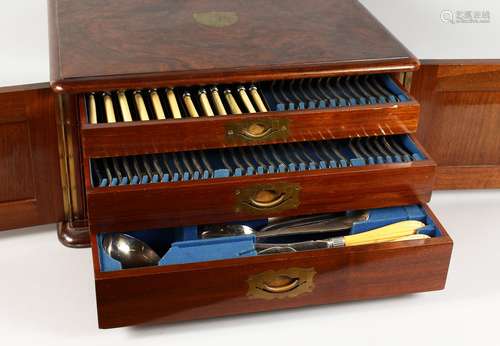 A VERY GOOD VICTORIAN WALNUT CASED TABLE CANTEEN OF PLATED FLATWARE, with two doors opening to