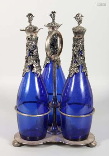 A PLATED THREE BOTTLE DECANTER SET, with 