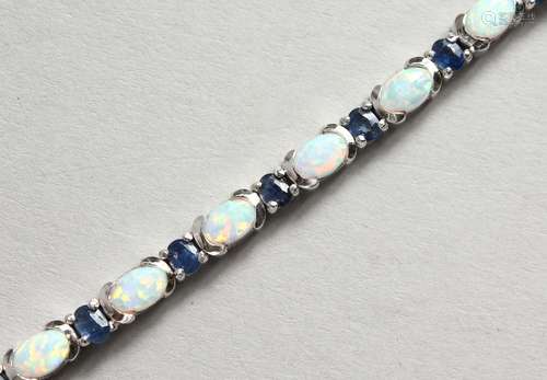 A GOOD SILVER, SAPPHIRE AND OPAL LINE BRACELET.