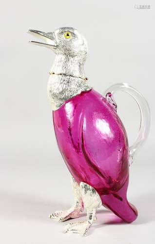 A DUCK SHAPED CLARET JUG, with plated head and feet, cranberry colour glass body. 11ins high.