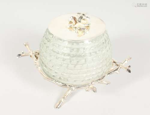 A FROSTED GLASS HONEY JAR with plated mounts.