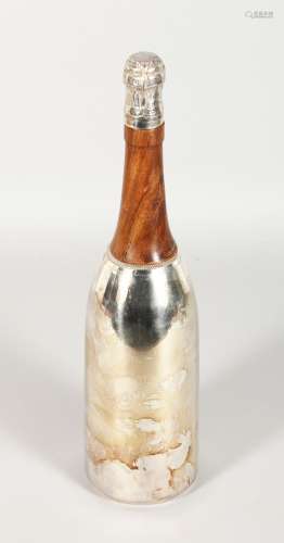 A NOVELTY PLATED AND TURNED WOOD CHAMPAGNE BOTTLE COCKTAIL SHAKER. 14ins high.