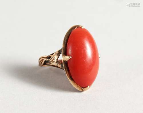 A GOLD AND CORAL RING.