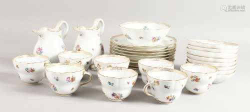A GOOD MEISSEN PART TEA SET, sprigged with flowers, comprising eight plates, two milk jugs, eight