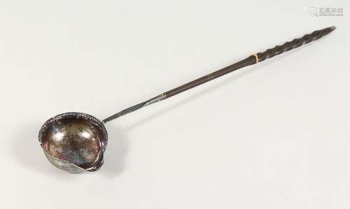 A SILVER TODDY LADLE, with twisted horn handle. 13.5ins long.