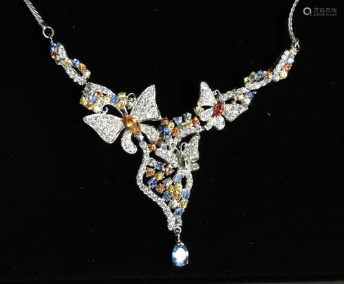 A LOVELY SILVER BUTTERFLY NECKLACE inset with tourmalines.