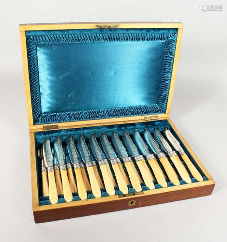 A GOOD CASED SET OF TWELVE FISH KNIVES AND FORKS.