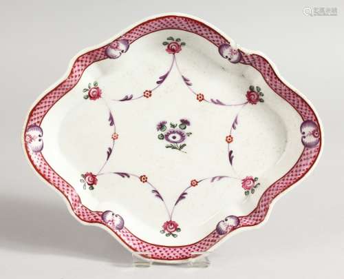 A NEW HALL SHAPED SPOON DISH with pink flowers. 7.25ins long.