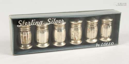 A BOXED SET OF SIX STERLING SILVER PEPPERETTES.