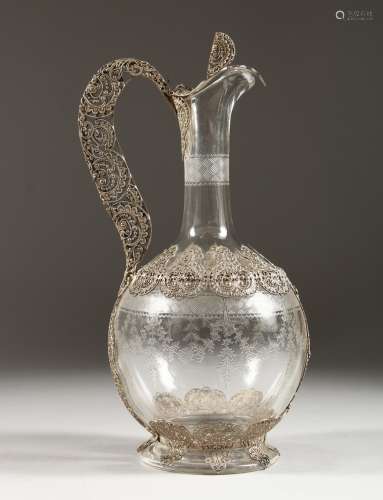 A SUPERB FILIGREE SILVER AND ETCHED GLASS CLARET JUG. 10.5ins high.