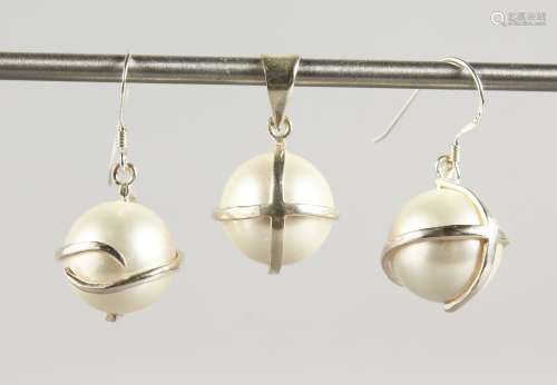 A SILVER AND PEARL PENDANT with a pair of matching earrings.