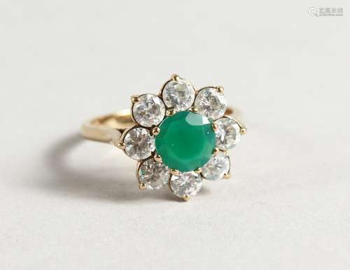 A 9CT GOLD, GREEN STONE / DIAMANTE RING.