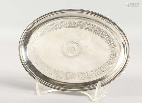 A SILVER OVAL TEAPOT STAND, with engraved decoration, on four curving feet. London 1805. 6.5ins