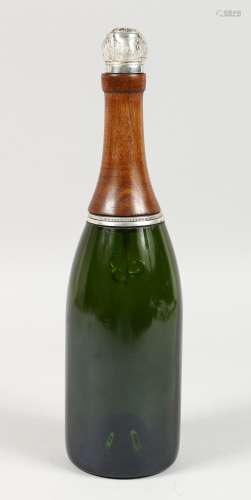 A COCKTAIL SHAKER SHAPED AS A CHAMPAGNE BOTTLE.