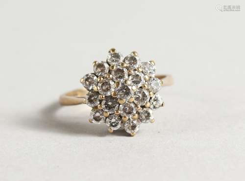 A 9CT GOLD DIAMANTE RING.