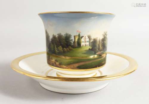A BERLIN TOPOGRAPHICAL CUP AND SAUCER.