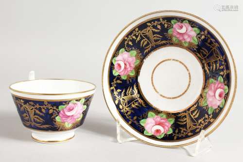 A DAVENPORT RICH BLUE CUP AND SAUCER painted with roses.