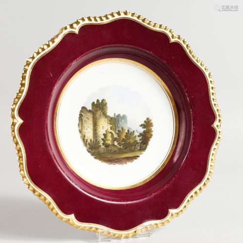 A WORCESTER FLIGHT BARR AND BARR PLATE painted with Amberley Castle, Sussex, on a claret ground,
