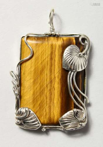 A SILVER AND TIGER'S EYE PENDANT.