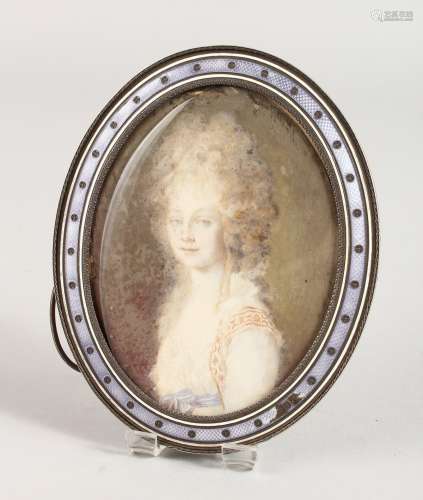 A SILVER AND ENAMEL OVAL PHOTOGRAPH FRAME, portrait head and shoulders of a young lady. 5ins x 3.