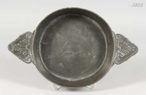 AN EARLY PEWTER CIRCULAR TWO-HANDLED QUAICH. 6.5ins diameter. stamped A. POULLYON.