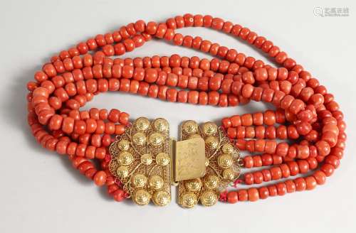 A SIX ROW CORAL BEAD NECKLACE WITH ORNATE 18CT GOLD CLASP. Approx. 14ins long.