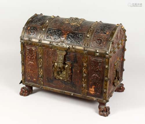 A 19TH / 20TH CENTURY CONTINENTAL BRASS BOUND AND EMBOSSED LEATHER DOME TOP CABINET, in Medieval