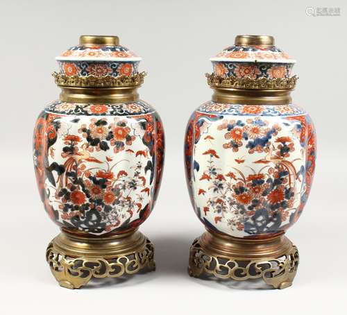 A VERY GOOD PAIR OF SAMSON OF PARIS IMARI PATTERN LAMPS, rich colours, in gilt, reds and blues.