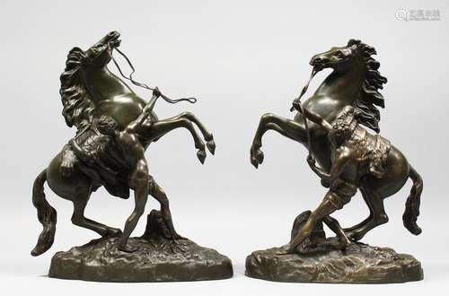 A GOOD PAIR OF 19TH CENTURY FRENCH BRONZE MARLEY HORSES AND ATTENDANTS after COUSTOU. Signed. 15.