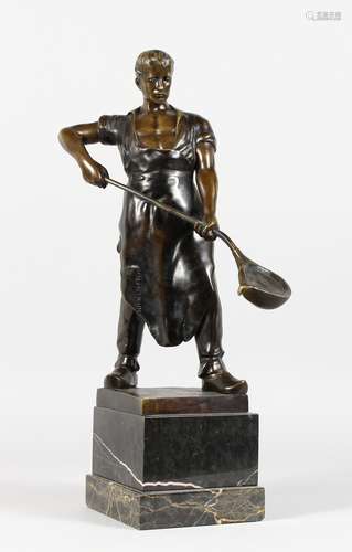 A 1940-1950 BRONZE STEEL WORKER, on a square base and marble plinth. 18ins high.