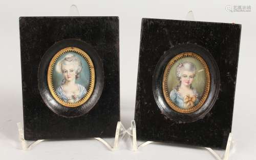 A PAIR OF OVAL PORTRAIT MINIATURES OF A YOUNG LADY in wooden frames. 1.75ins x 1.5ins. Signed.