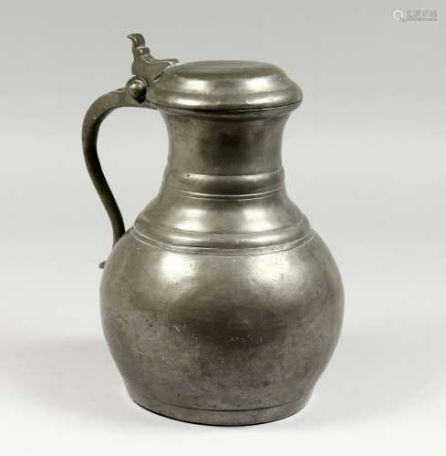 A LARGE FRENCH PEWTER JUG AND COVER.